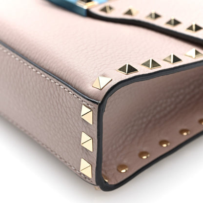 Valentino Garavani Pebbled Calfskin Medium Rockstud Flip Lock Crossbody Bag Poudre